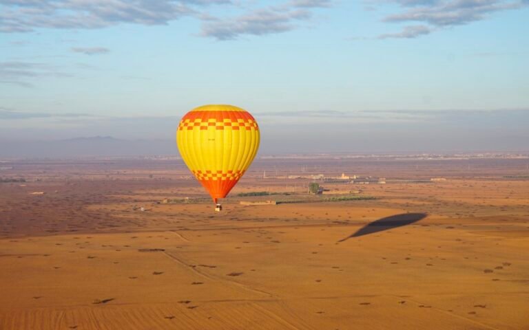 Hot air balloon over the plain near Marrakech at sunrise